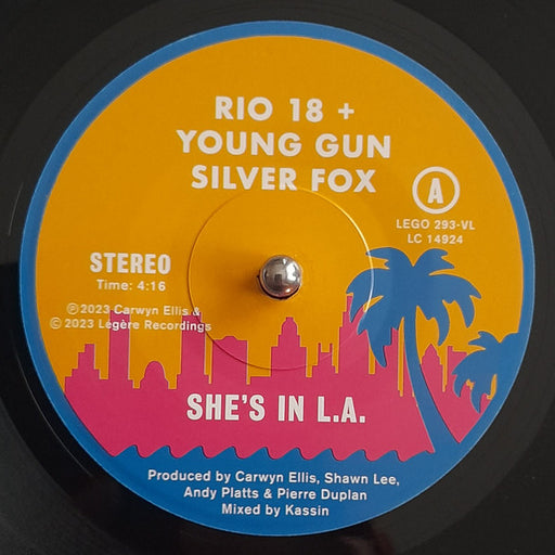 Rio 18* + Young Gun Silver Fox : She's In L.A. (7", Single, Ltd)