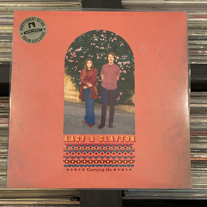 Kacy & Clayton - Carrying On - Pink Vinyl LP. This is a product listing from Released Records Leeds, specialists in new, rare & preloved vinyl records.