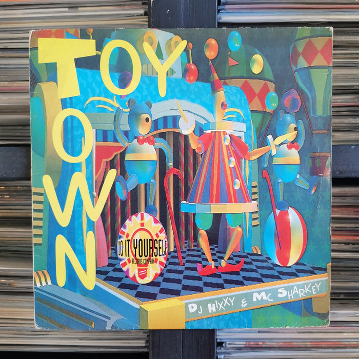 DJ Hixxy & MC Sharkey - Toy Town - 12". This is a product listing from Released Records Leeds, specialists in new, rare & preloved vinyl records.