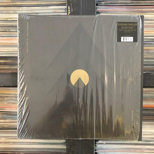 Russian Circles - Blood Year - Vinyl LP 04.02.23 Gold. This is a product listing from Released Records Leeds, specialists in new, rare & preloved vinyl records.