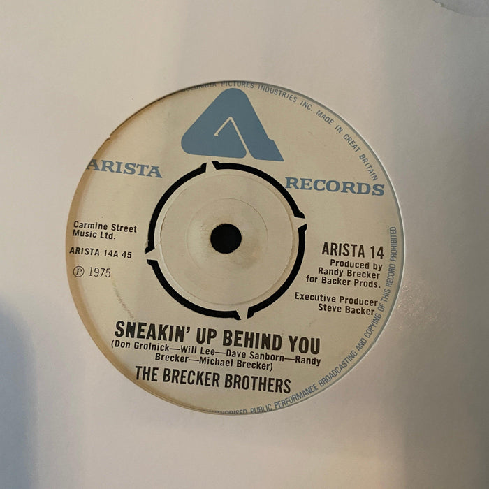 The Brecker Brothers - Sneakin' Up Behind You - 7" Vinyl. This is a product listing from Released Records Leeds, specialists in new, rare & preloved vinyl records.