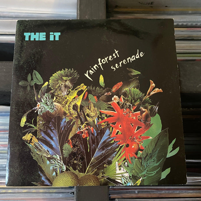 The It - Rainforest Serenade - 7" Vinyl. This is a product listing from Released Records Leeds, specialists in new, rare & preloved vinyl records.