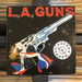 L.A. Guns - Cocked & Loaded - Vinyl LP. This is a product listing from Released Records Leeds, specialists in new, rare & preloved vinyl records.