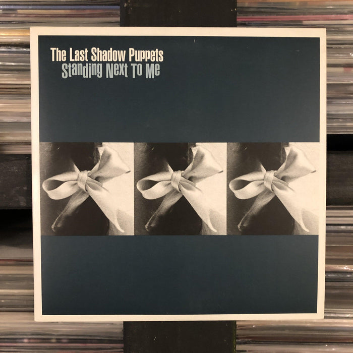 The Last Shadow Puppets - Standing Next To Me - 7". This is a product listing from Released Records Leeds, specialists in new, rare & preloved vinyl records.