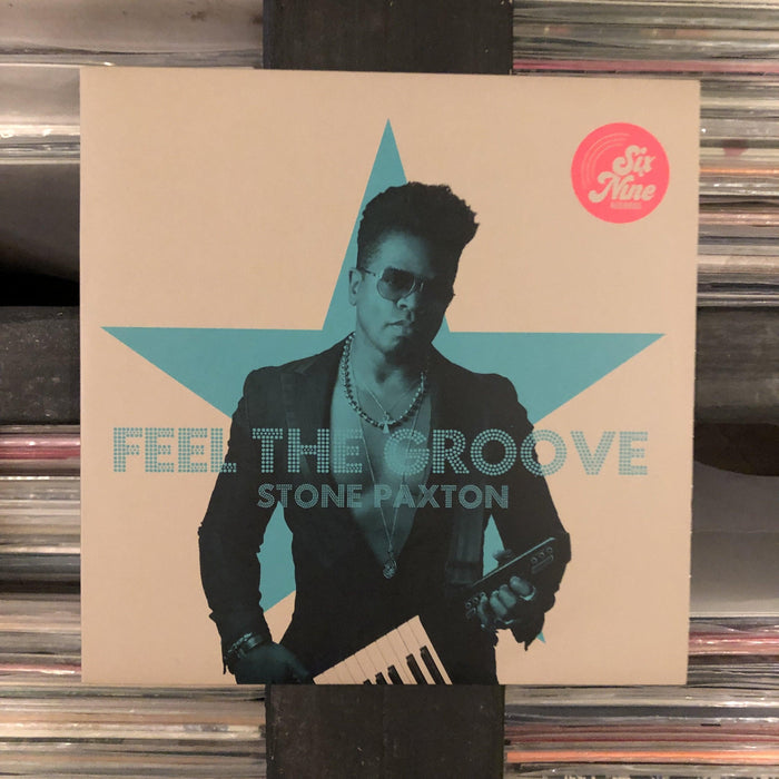 Stone Paxton - Feel The Groove / I Don't Think She's Gone (UK Club Mix / T-Groove Remix) - 7" Vinyl. This is a product listing from Released Records Leeds, specialists in new, rare & preloved vinyl records.