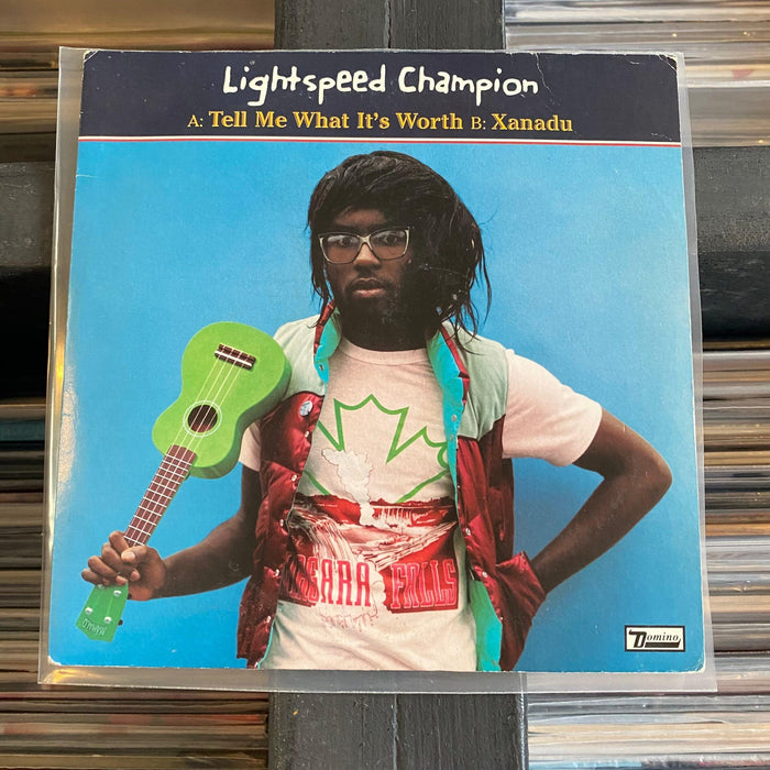 Lightspeed Champion - Tell Me What It's Worth - 7" Vinyl. This is a product listing from Released Records Leeds, specialists in new, rare & preloved vinyl records.